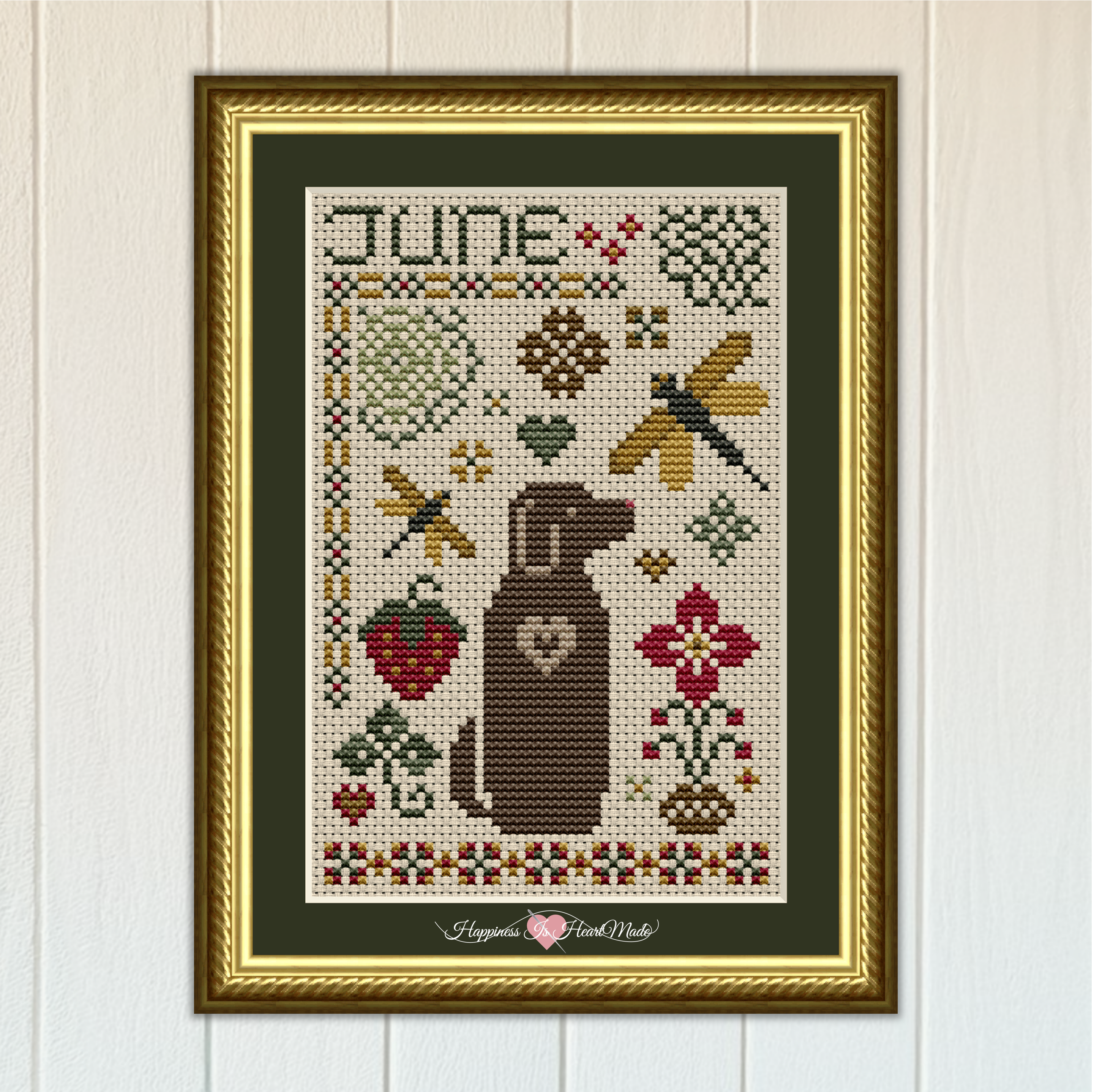 June Dog Cross Stitch Pattern 6556 from The Dog Days Series by Happiness Is HeartMade. A brown chocolate lab i surrounded by dragonflies and flowers. This pattern is part of a monthly cross stitch series with dogs.