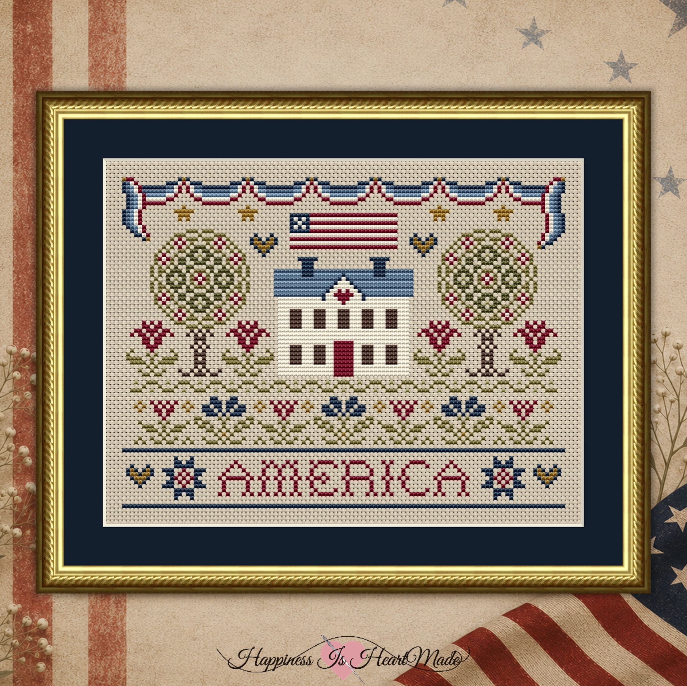 An American Home Patriotic Cross Stitch Pattern 1079 from Happiness Is HeartMade. This design has a central house with a flag above it. The word America is below the house. Flowers, trees, and a patriotic bunting complete the design.