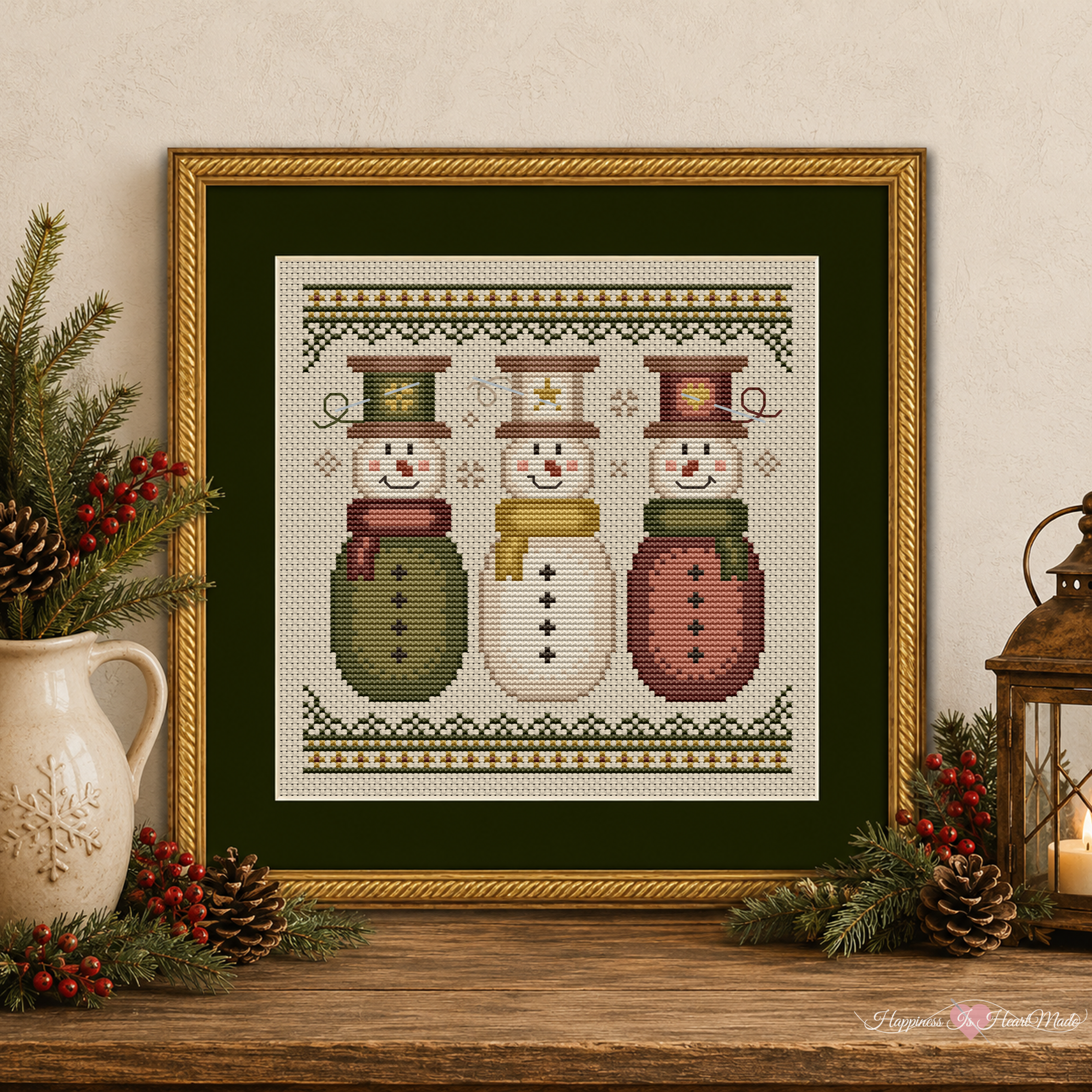 The Sew Merry Snowmen cross stitch pattern is a festive Christmas snowman cross stitch pattern. This cute design has three snowmen with thread spool hats and sewing needles. It is from Happiness Is HeartMade, and designed by Christy Shuhy Ortiz.