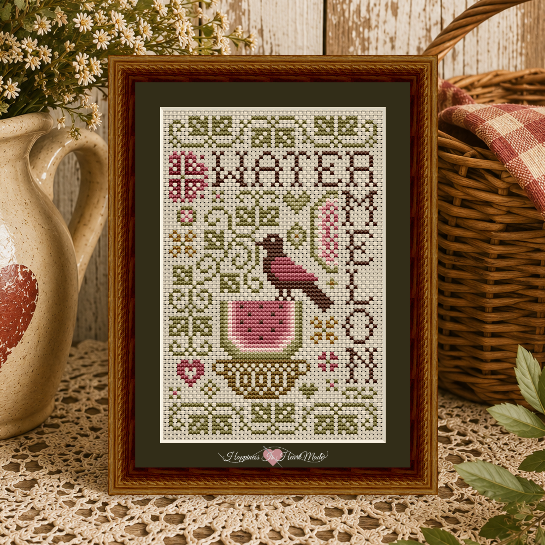 Gathered from the Garden Watermelon Cross Stitch Pattern from Happiness Is HeartMade, Pattern 1516. Designed by Christy Shuhy Ortiz. A summer folk-inspired cross stitch pattern with a watermelon, bird, and pink flowers. 