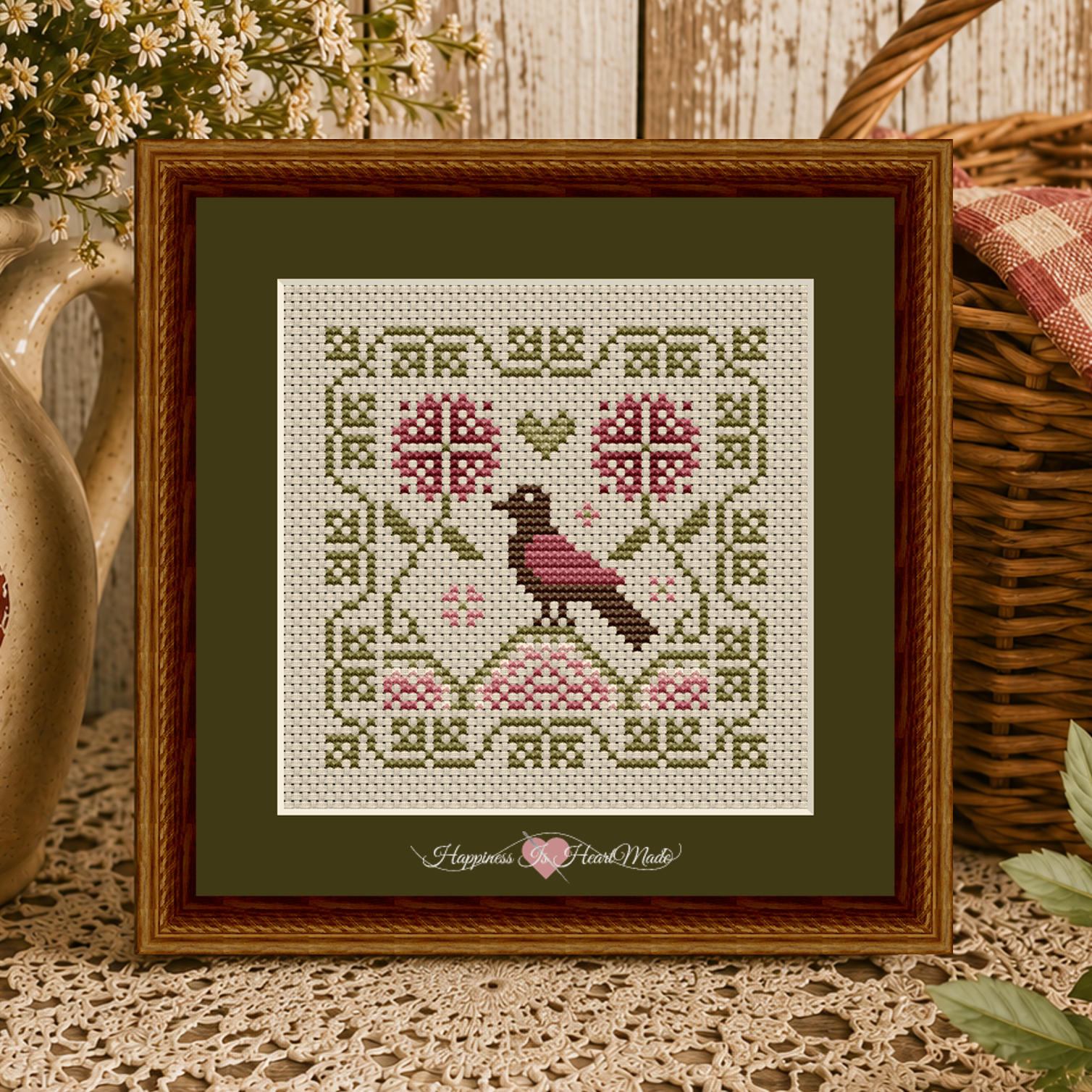 Gathered from the Garden - The Garden Perch - Cross Stitch Pattern from Happiness Is HeartMade, Pattern 1517. Designed by Christy Shuhy Ortiz. A summer folk-inspired cross stitch pattern with a folk-style bird, vines, watermelon colored medallions, and pink flowers.